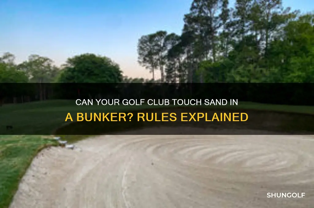 can golf club touch sand in bunker