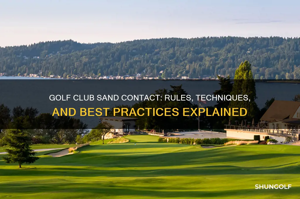 can you touch the sand with your golf club