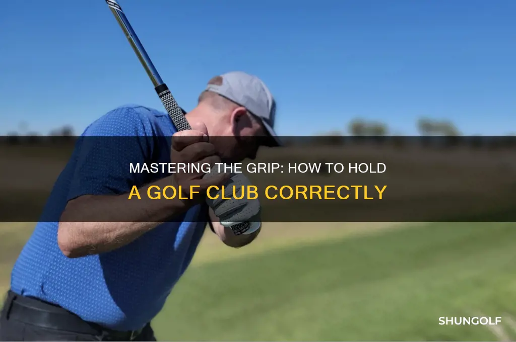 how do u hold a golf club