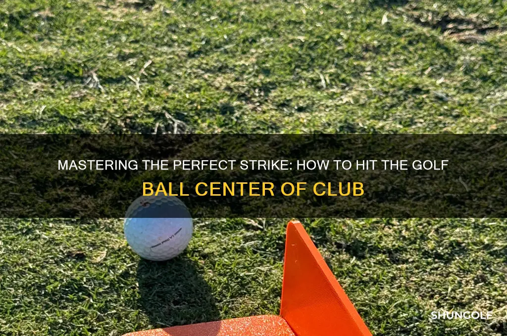 how to hit golf ball center of club