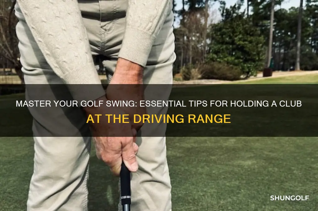 how to hold golf club driving range