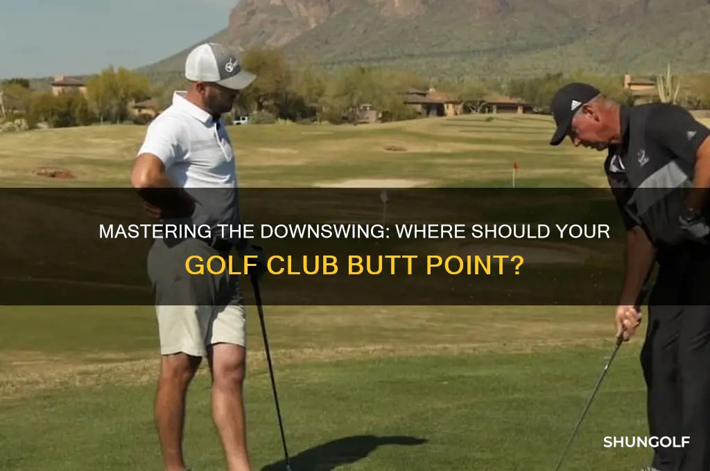 where should butt of golf club point during downswing