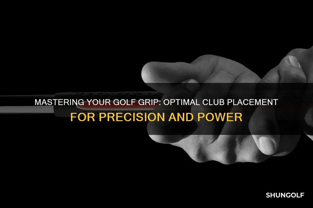 where should the golf club sit in your hand