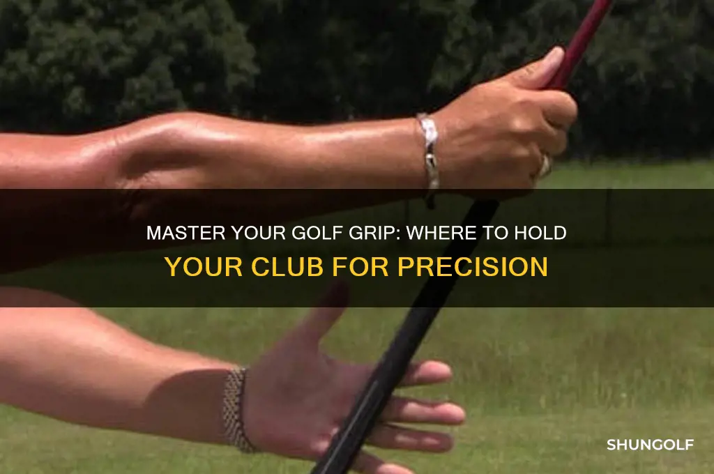 where should you hold a golf club